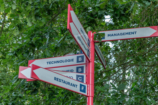Hasselt, Belgium. Directional campus signpost with wayfinding signs at Hasselt University campus in Diepenbeek