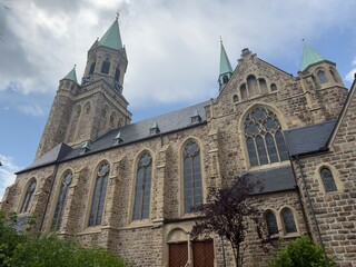 Fototapeta premium Gothic stone church with cloudy sky in Germany