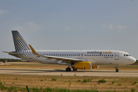Vueling Airbus passenger aircraft taxiing on runway at Valencia airport. Valencia, Spain - June 20, 2026.