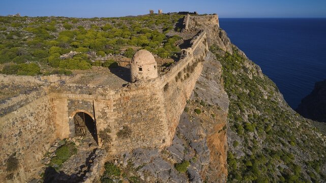Drone shot, A stony section of a former fortress along a cliff edge overlooking the sea, Venetian sea fortress, Gramvoussa, Gramvoussa peninsula, Pirate Bay, Balos, Lagoon, Northwest Crete, Crete, Greek Islands, Greece