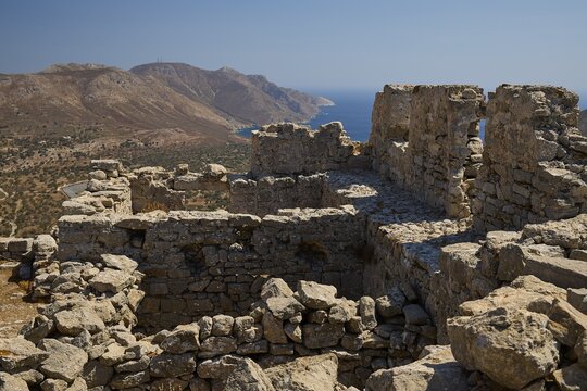 Ancient ruins on a hill with views of mountains and the sea, surrounded by clear blue sky, Johanniter fortress from the 14th century AD, fortress of Megalo Chorio, Kastro, Megalo Chorio, Zero Waste Island, Tilos, Dodecanese, Greek Islands, Greece