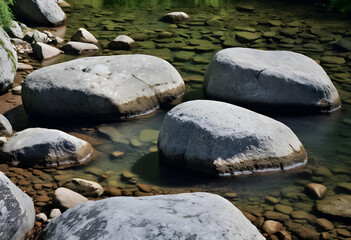 Fototapeta premium Three large rocks in a clear stream with natural lighting