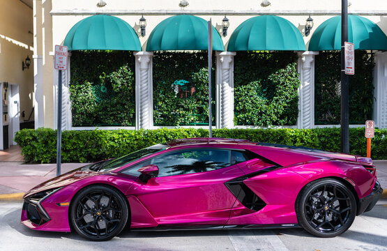 Miami, Florida, USA - July 27, 2025: 2024 Lamborghini Revuelto hybrid supercar coupe car. Luxury sportscar Lamborghini Revuelto. Car Lamborghini Revuelto parked outdoor. Pink car, side view.