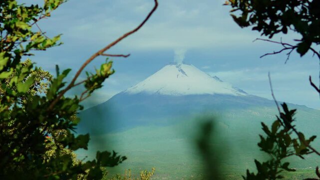 Popocatepetl volcano fumarole framed by nature