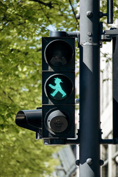 Berlin, Germany - April 23, 2026: Green Ampelmann pedestrian traffic signal on Unter den Linden in central Berlin.