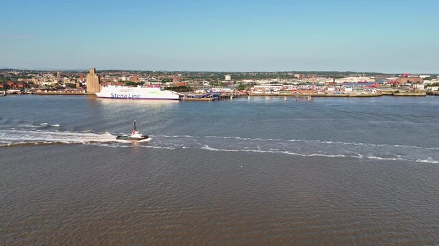 Tugboat Sailing Across River Mersey Liverpool Aerial View