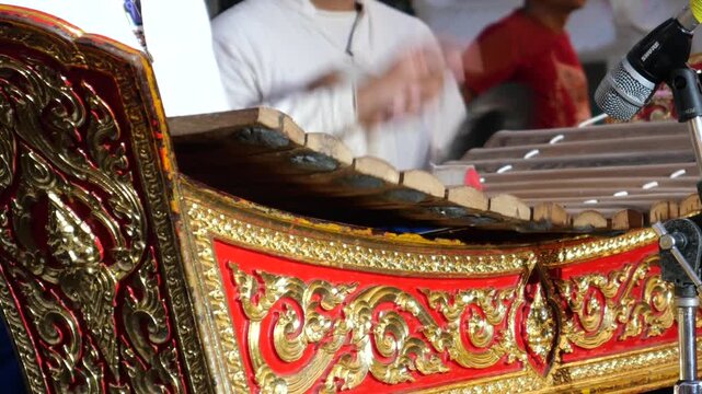 Playing Thai xylophone