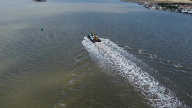 Drone view of a mini dredger carrying out maintenance work on the River Humber. 