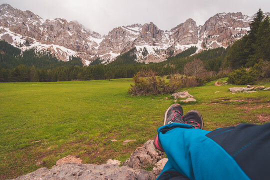 A woman hiker resting in the Pyrenees on the way to Prat de Cadi (Spain)