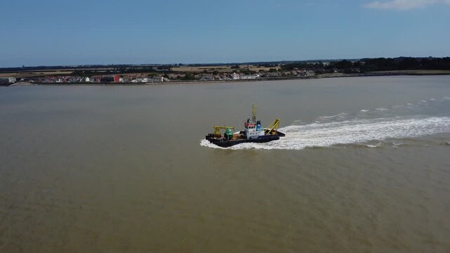Drone view of a mini dredger carrying out maintenance work on the River Humber. 