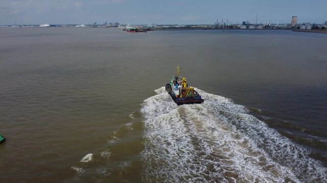 Drone view of a mini dredger carrying out maintenance work on the River Humber. 