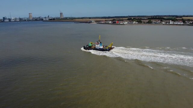 Drone view of a mini dredger carrying out maintenance work on the River Humber. 