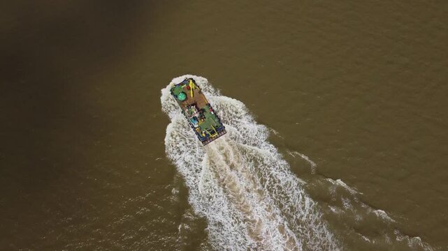 Drone view of a mini dredger carrying out maintenance work on the River Humber. 