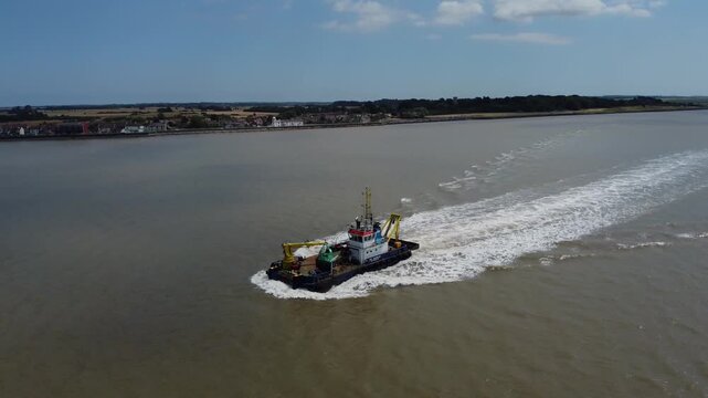 Drone view of a mini dredger carrying out maintenance work on the River Humber. 