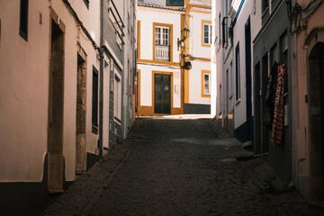 Fototapeta premium From the narrow cobblestone alleys of Lagos Portugal, Algarve. Charming street with whitewashed old houses. 