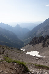 Fototapeta premium Mountain valley and hiking trail with snow patch, Germany, Bavaria, Oberstdorf, 28 June 2026