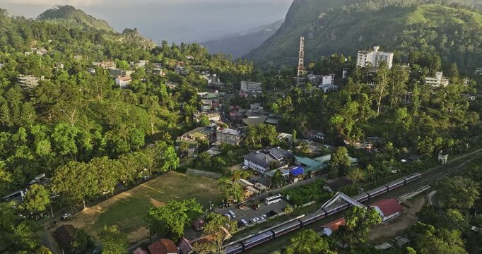 Ella Sri Lanka Aerial v6 cinematic birds eye view drone flyover railway station capturing charming mountain town, narrow streets and verdant valleys at sunset - Shot with Mavic 3 Cine - April 2023