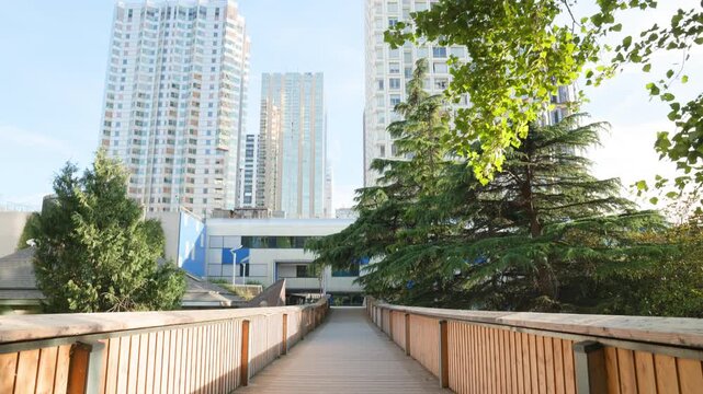 Slow Tilt Up from Pedestrian Walkway to Modernist Skyscrapers at Front de Seine Beaugrenelle Paris