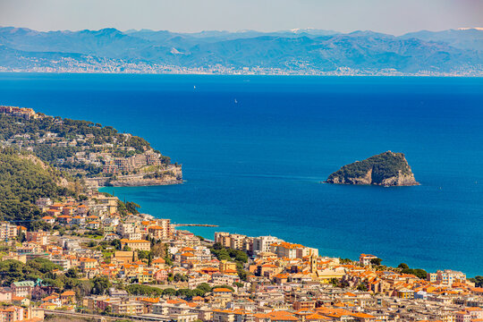 Aerial panoramic view of the coast of Spotorno, Bergeggi Island, Torre del Mare, Liguria, province of Savona, Italy. Riviera dei Fiori. Western Riviera. Ligurian Sea