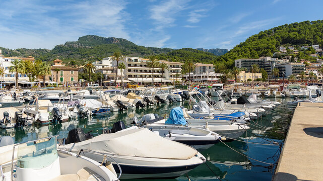 Port de Soller bay aerial view with marina and mountain backdrop, Mallorca