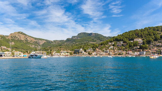 Port de Soller bay with turquoise sea and blue sky, wide angle view, Mallorca
