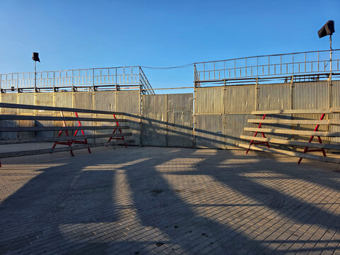 Temporary barriers and benches set for Bulls in the Sea festival arena in Denia Spain in preparation for the upcoming event