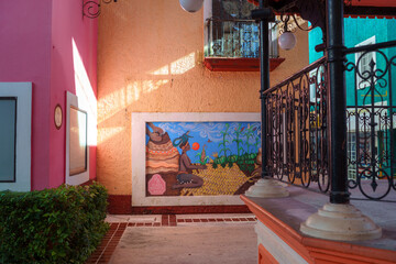 Mexican plaza mural with indigenous cultural artwork © Kai Grim