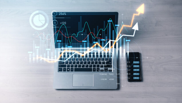 A modern laptop displays vibrant data visualization on the screen, accompanied by a smartphone, illustrating business growth insights and financial analytics for professionals. Scalp