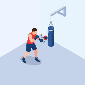 Boxer training with punching bag in gym setting.
