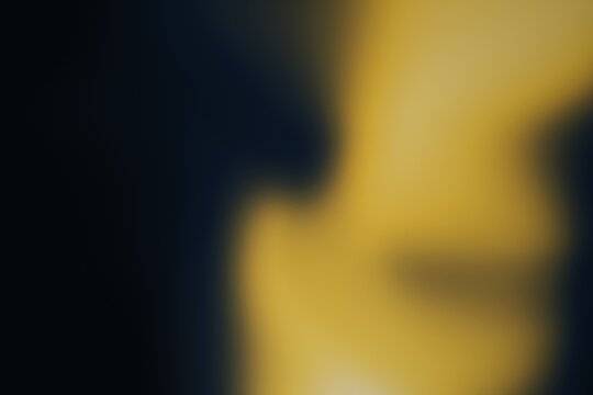 Abstract blurred background with dark blue and yellow gradients