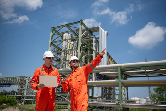 Refinery industry, engineer working in industrial production, oil and gas refinery plant industry factory.