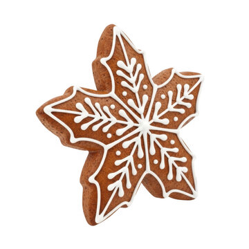 Brown gingerbread snowflake cookie with white icing isolated on transparent background