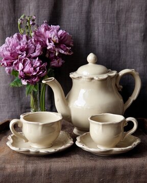 Ceramic tea set with flowers in soft daylight commercial still life arrangement Generative AI
