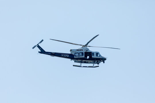 Jersey City, New Jersey, USA. 8th Jul 2026. An NYPD Aviation Unit helicopter flies over New York Harbor during Sail4th 250.