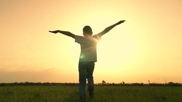 boy son child running airplane game flight dream playground green field sunset, child run pilot family, boy's model airplane, son flying dreams, kid's outdoor aviation, aspiring young flyer, sunset