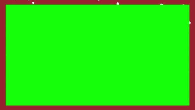 Green screen surface displays a deep red border frame accented by scattered white sparkles along the top edge for creative media projects.