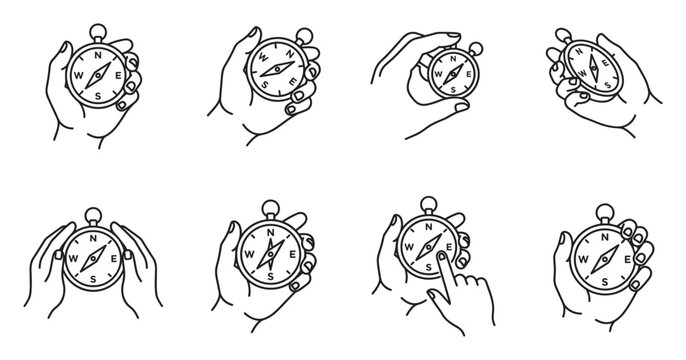 Hand holding compass, navigation tool showing direction for travel and adventure.