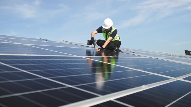 Technician installing rooftop solar panels for green energy, supporting renewable energy, clean power, sustainable technology and solar infrastructure.