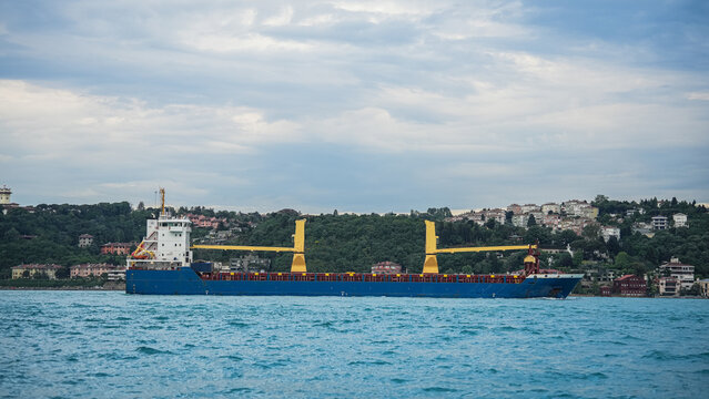 Large commercial cargo ships transit the Bosphorus Strait on their way to the Strait of Hormuz. Cargo ships bound for the Strait of Hormuz.
