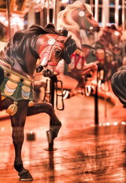 Vintage Carousel Horses with Warm Lights and Shallow Depth of Field