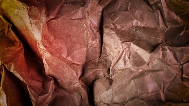  crumpled brown sexture shimmering under dynamic studio lighting creating abstract metallic pattern 4k video