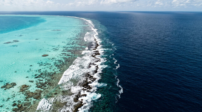 Turquoise Coral Reef Meets Deep Blue Ocean, Aerial View