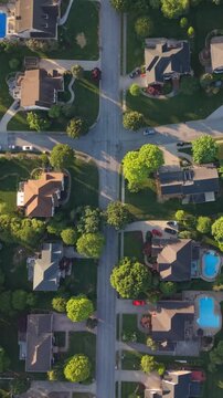 Vertical screen. Aerial perspective of suburban area Johnson City, Tennessee, featuring neatly arranged homes, green lawns swimming pools tranquil environment community layout of neighborhood