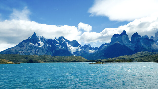 Torres del Paine National Park, Patagonia, Chile &mdash; a stunning view of turquoise lakes, rugged mountains, and snow-capped peaks under a bright blue sky