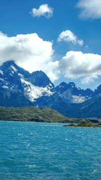 Torres del Paine National Park, Patagonia, Chile &mdash; a stunning view of turquoise lakes, rugged mountains, and snow-capped peaks under a bright blue sky