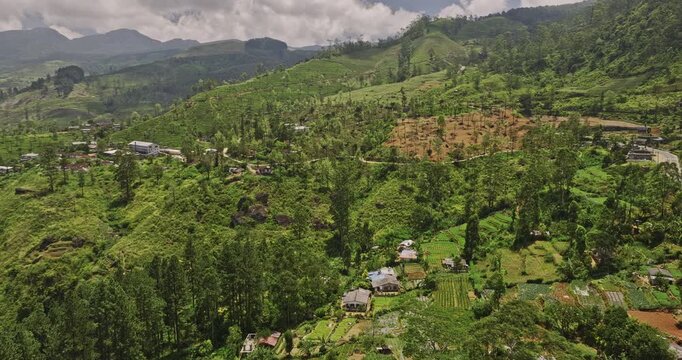 Palagolla Sri Lanka Aerial v4 drone flyover small village town capturing hilly mountain landscape with hillside tea plantation, A5 road and Kotmale reservoir - Shot with Mavic 3 Cine - April 2023
