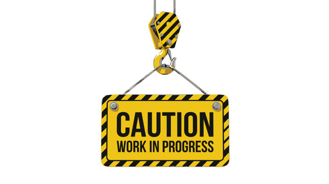 Bright yellow caution work in progress sign hanging from a heavy duty industrial steel construction crane hook isolated on a clean white studio background surface