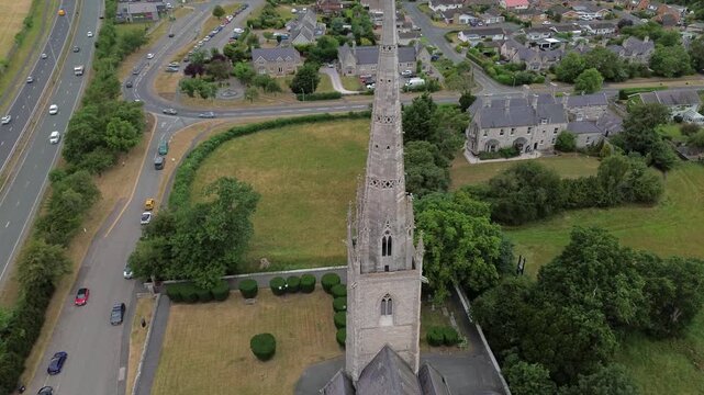 St Margaret's Marble church aerial view circles neo gothic steeple overlooking the A55 motorway Rhyl