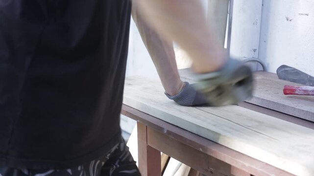 Close Up of a Man Painting Wooden Boards with Brown Paint, HD Video