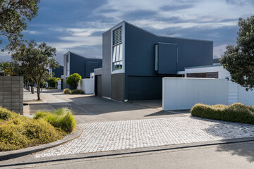 Fototapeta premium Car background, automotive backplate, residential street with modern residential houses in background